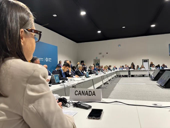 Canada’s Ambassador for Climate Change, Catherine Stewart with delegates around a large table in Baku, Azerbaijan. 