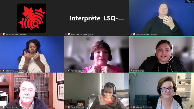 Image from the Q&A portion of the panel 'Sealing the Cracks: Policy Solutions for Inclusive Housing.' Six speakers and interpreters are present in a virtual meeting setup:

Top left: ASL Interpreter Jordan, wearing a white shirt. Top middle: LSQ-French Interpreter 1, with a blurred background. Top right: ASL Interpreter Valarie, wearing a black shirt against a blue backdrop. Middle row, left to right:

LSQ-French Interpreter 2, wearing a light blouse, gesturing expressively.
Patti Chiappetta, wearing a bright pink shirt, looking focused with her hands near her neck.
Emily Branje, wearing a black shirt and white headset, smiling warmly. Bottom row, left to right:
Danny Soucy, wearing glasses and a dark sweater, looking attentive.
Patty O’Donnell, wearing a grey hoodie, looking downward, smiling slightly.
Monica Schroeder, wearing glasses and a white and black shirt, smiling with a neutral background.
The interpreters and speakers represent a collaborative discussion on inclusive housing