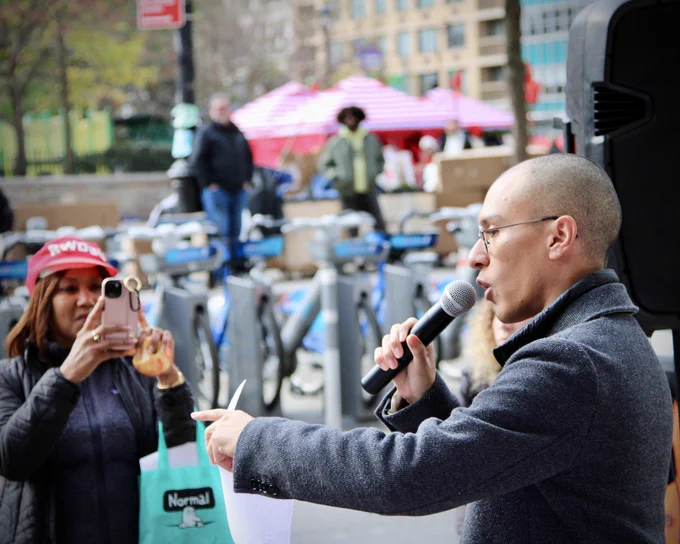 Aaron Lascano speaks to the crowd at a rally