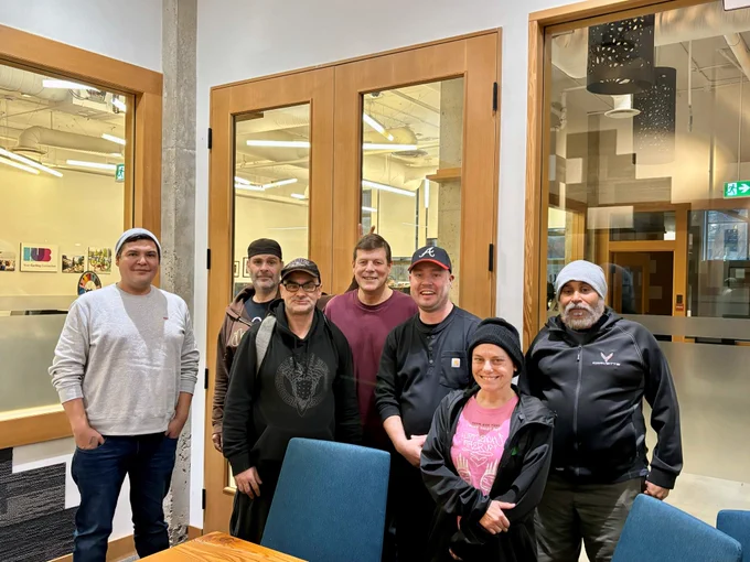 Members of Exchange Inner City's, Resident Advisory Council (RAC), with lead  coordinator, John Zador. Picture taken during our monthly RAC meeting at 312 Main.