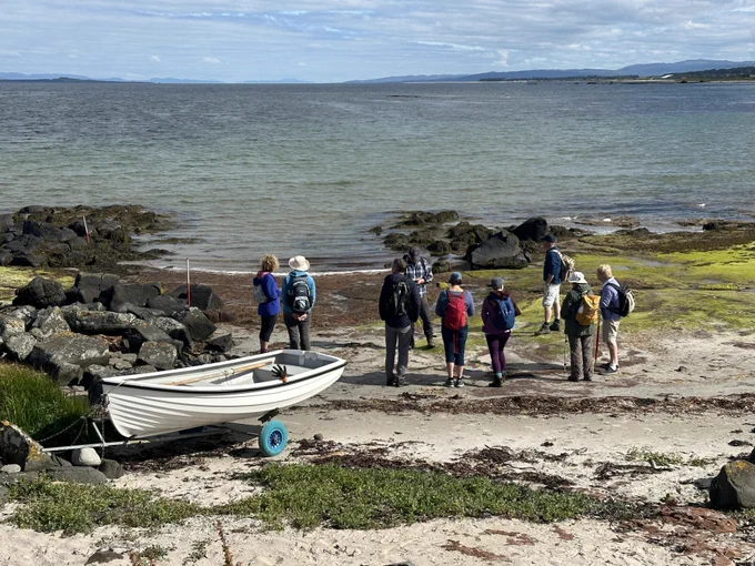 Volunteers record a cleared slipway at A'Chleit, on the west coast of Kintyre, with Gigha and Tayinloan in the background. Our research showed that this area was rich in landing places, used by people heading to Gigha and beyond for centuries. 
