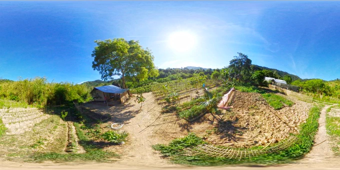 A 360° view of a farm on a hill, where the sky meets the earth in a breathtaking display of natural beauty.