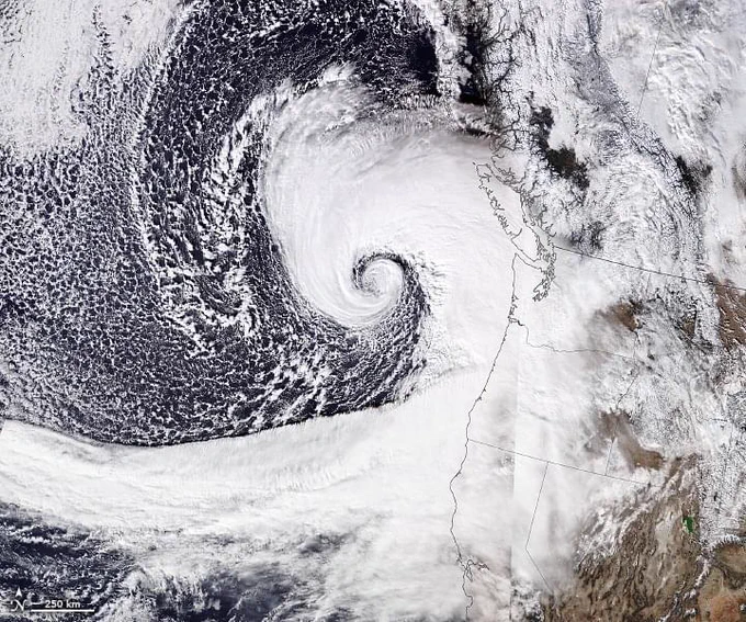 Satellite image of a spiralling cyclone over the Pacific Ocean.