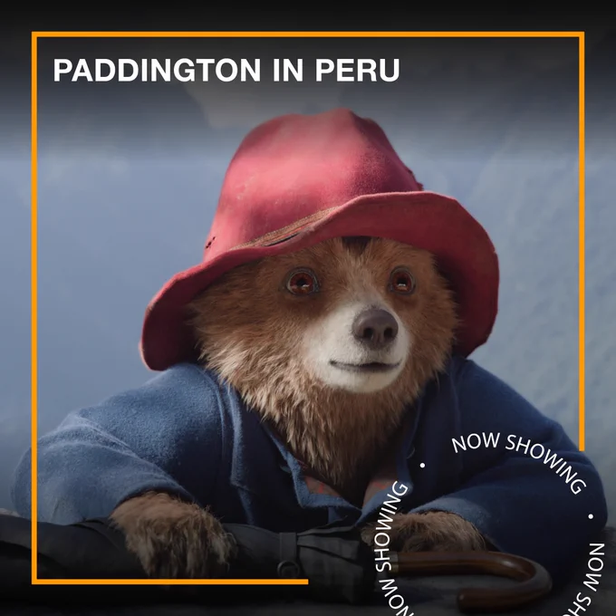 Paddington, a small brown bear wearing a red hat and a blue coat. Text - Paddington in Peru, Now Showing