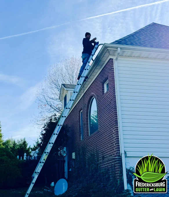 Jeffrey E Porter cleaning gutters for Fredericksburg Gutter and Lawn gutter Guards Stafford Virginia