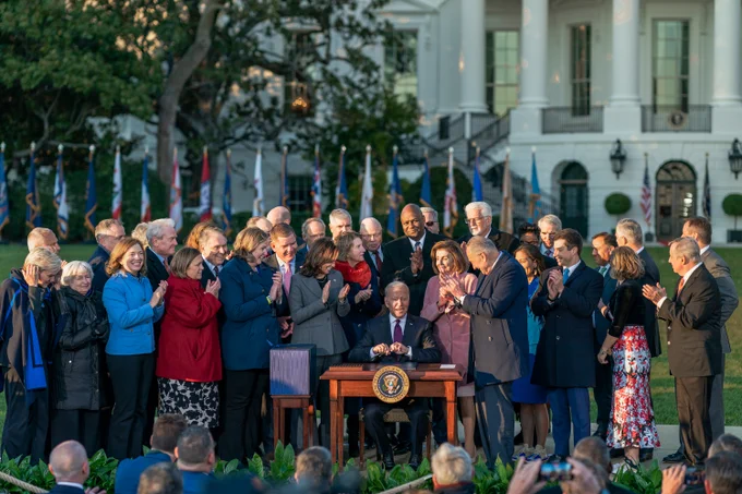 President Biden signs the Bipartisan Infrastructure Law on the South Lawn of the White House.