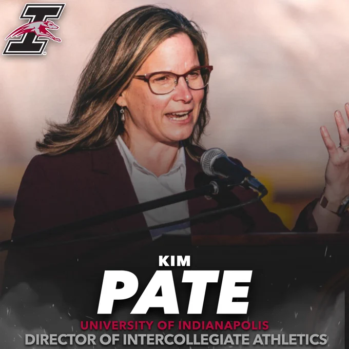 Kim Pate is the next UIndy Athletics Director. Pictured: Pate address a crowd at a podium.