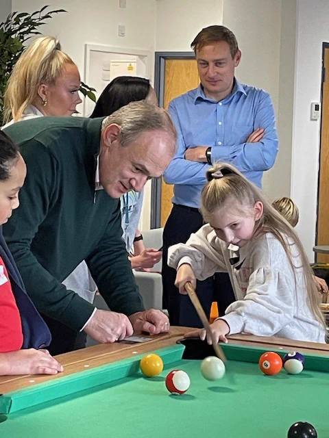 Young carers with Sir Ed Davey and Olly Glover - playing pool