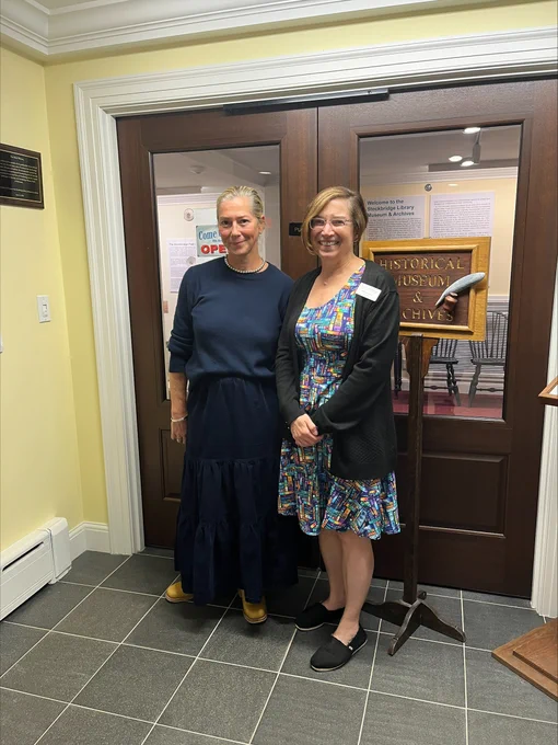 Stockbridge Public Library Director Wendy Pearson and MBLC Director Maureen Amyot in front of the doors of the Stockbridge Historical Museum & Archives.