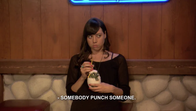 April looking bored and saying "somebody punch someone."