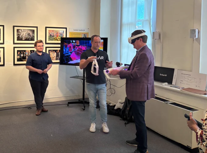 Morris Bart wears VR goggles at NOAI this year.