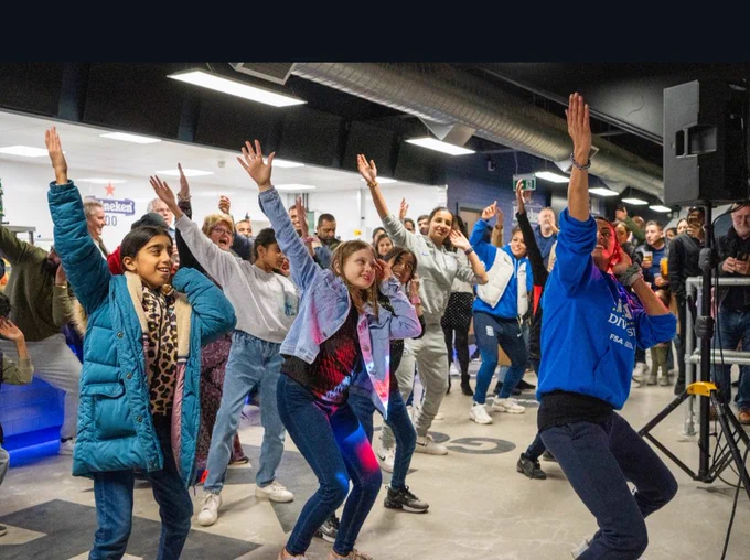 Fans doing bhangra moves in the Box 2 Box Bar