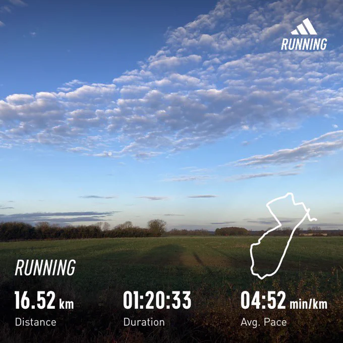 Light cloud in a blue morning sky about green field; running stats superimposed (1:20:33, 16.52km)