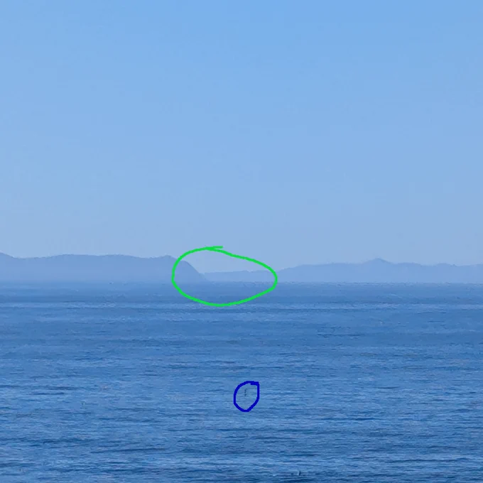 Photo 3, about 100 ft of elevation. the target of my photo is circled in green, the red circle is around a buoy that can also be seen in photo 4
