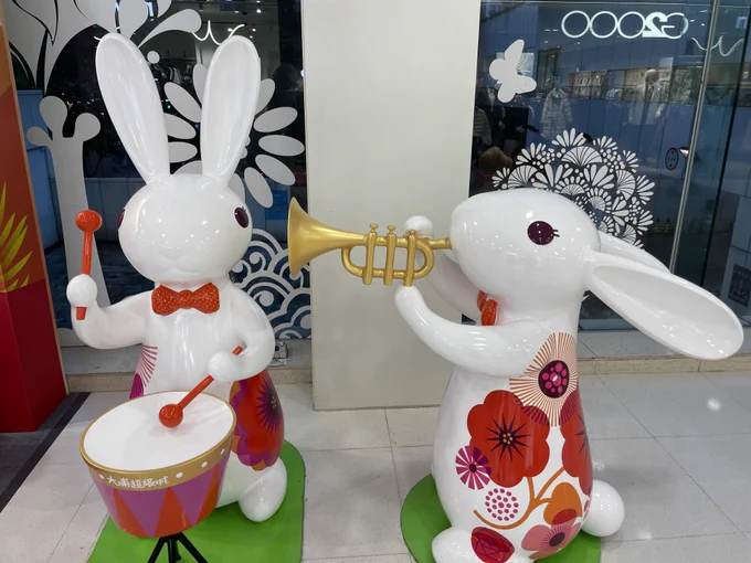 One bunny blows the ears off of the percussion section in a beginning band display at a mall in Hong Kong.