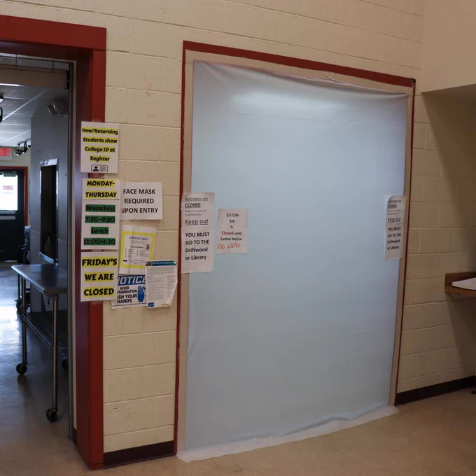A room at Little Big Horn College in Montana has been sealed off with a plastic cover instead of a door. Signs on the cover and on the surrounding walls note that “Restrooms are Closed.” and students must keep out.