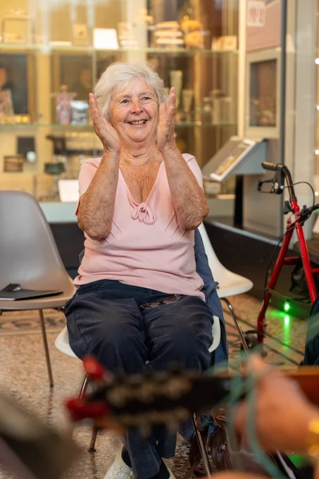 Older lady clapping her hands in a Sounds Beaney workshop