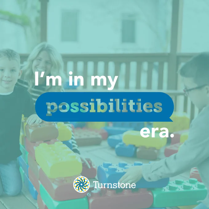 Text overlayed on an image of a woman and her two kids playing outdoors with giant legos. The text reads "I'm in my Possibilities Era." Turnstone logo at the bottom. 