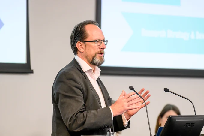 Dr Mike Shaw, Director of King's Innovation Catalyst, presenting at the 2024 ECR conference.