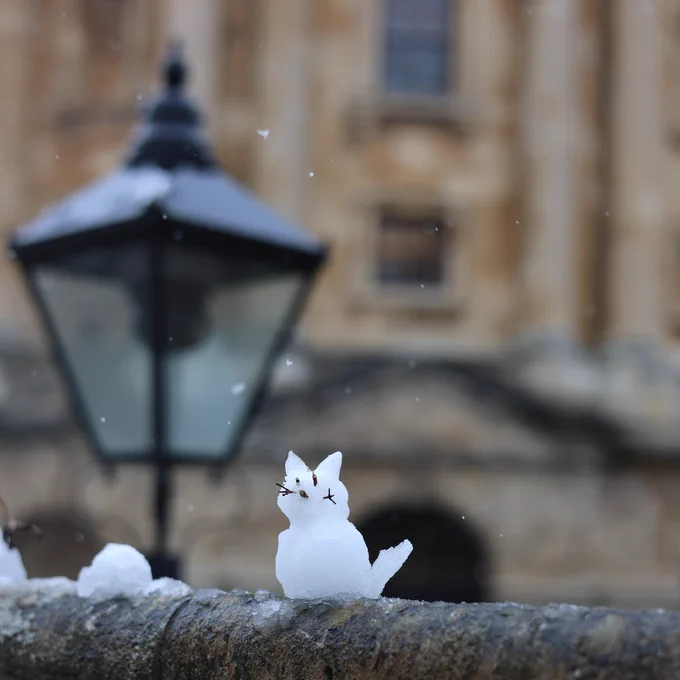 A snow cat with the Radcliffe Camera behind