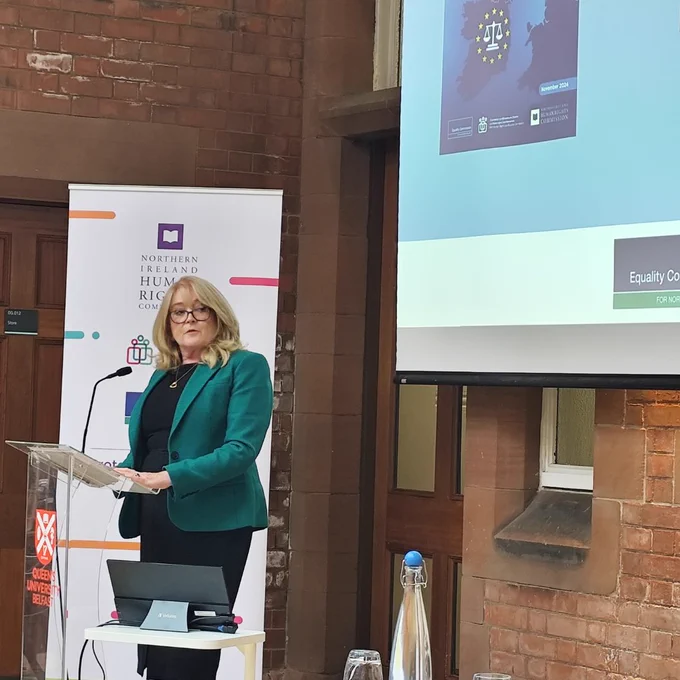 A photo of Geraldine McGahey, Chief Commissioner, ECNI, speaking at the research launch of the EU developments in equality and human rights in Riddel Hall
