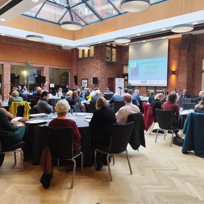 A photo of attendees at Riddel Hall for a joint research launch event on EU developments in equality and human rights.
