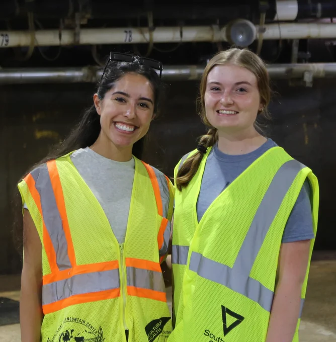Rebecca Lyons (on the right) smiles for a picture.