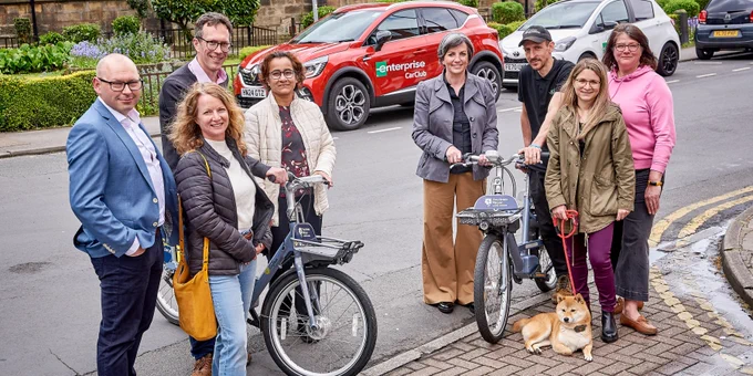 Photo of INFUZE partners, from left to right: Sonja Woodcock (Leeds ACTS) Storm Baines (Enterprise Mobility) Professor Greg Marsden (Director of INFUZE) Professor Charisma Choudhury (Institute for Transport Studies) Councillor Helen Hayden (Leeds City Council Executive Member for Sustainable Development and Infrastructure) Dan Bell (Beryl) Dr Chiara Calastri (institute for Transport Studies) Stephanie Burras (Ahead Partnership). Image credit: Victor de Jesus