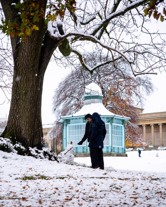 Person with snowman in Weston Park