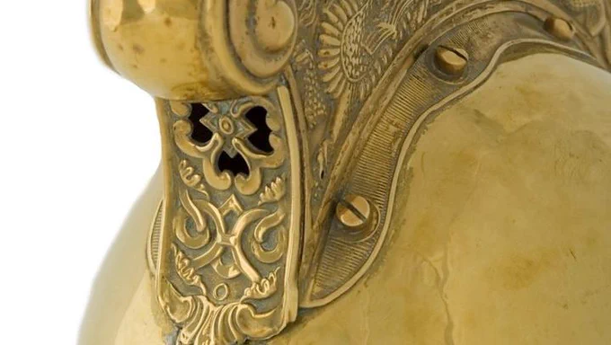 Close up detail of Victorian brass fire helmet
