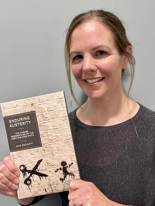 Me, with a hardback copy of my new book, 'Enduring Austerity: The Uneven Geographies of the Post-Welfare State'