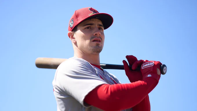 Outfielder Matt Koperniak holds a baseball bat on his shoulder.