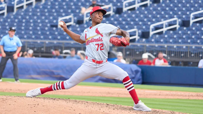 Right-handed pitcher Tink Hence throws a pitch in a Cardinals Spring Training game.