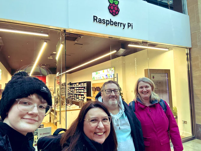Four mentors from CoderDojo Banbridge standing outside the Raspberry Pi store and smiling