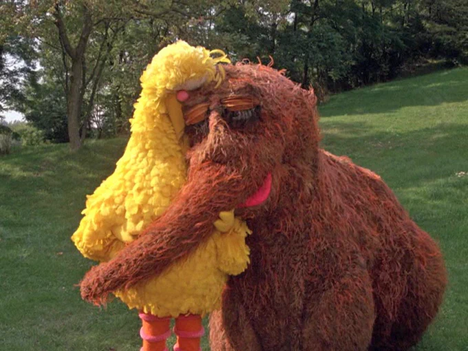 a picture of Big Bird hugging his best friend Mr. Snuffleupagus in the 1985 Sesame Street movie Follow That Bird