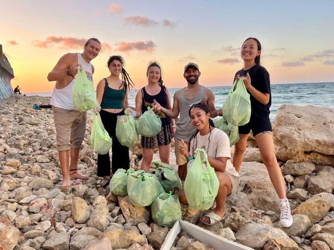 Group of volunteers picking up trash with Tuesdays for Trash.