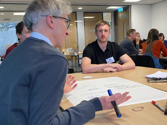 Animated discussion round a table