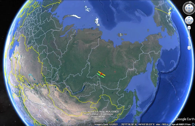Digital image of Earth, showing the flight path of an asteroid in yellow and green. 