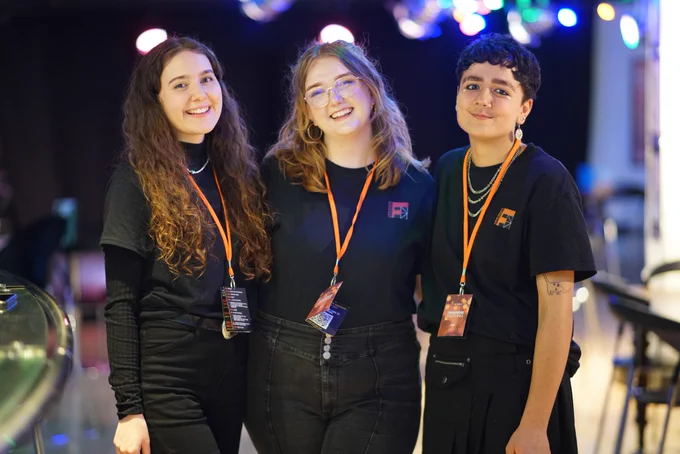The core Framework Theatre team (Morna, Emma & Nay) smiling towards the camera at Framework Festival 2024.