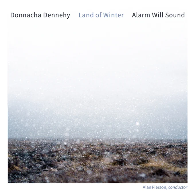 An album cover featuring a photo of rain falling on a field. Text reads “Donnacha Dennehy...Land of Winter...Alarm Will Sound.”