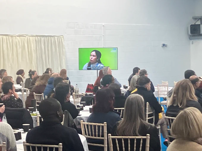 colleagues sat down at the inclusion and belonging conference