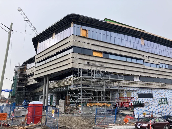 Corner view of the Ādisōke facility showcasing the completed windows and removed scaffolding.