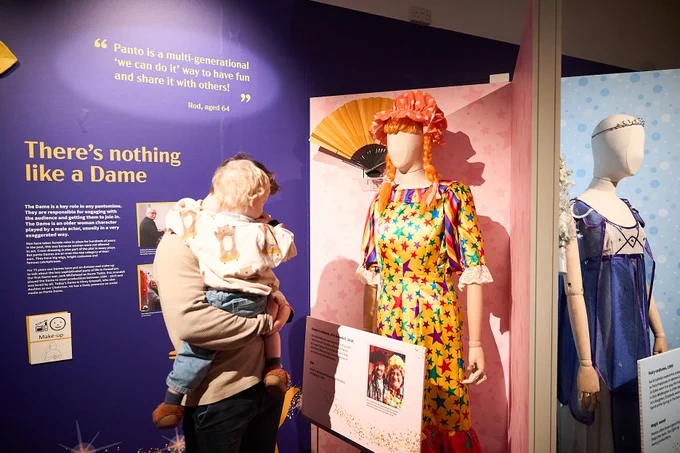 Visitors looking at the exhibition display