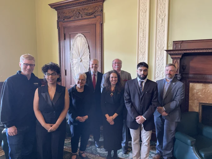 Legislators, staff, and people experiencing homelessness with lived experiences at the State House for a legislative briefing on the MA ID Bill.