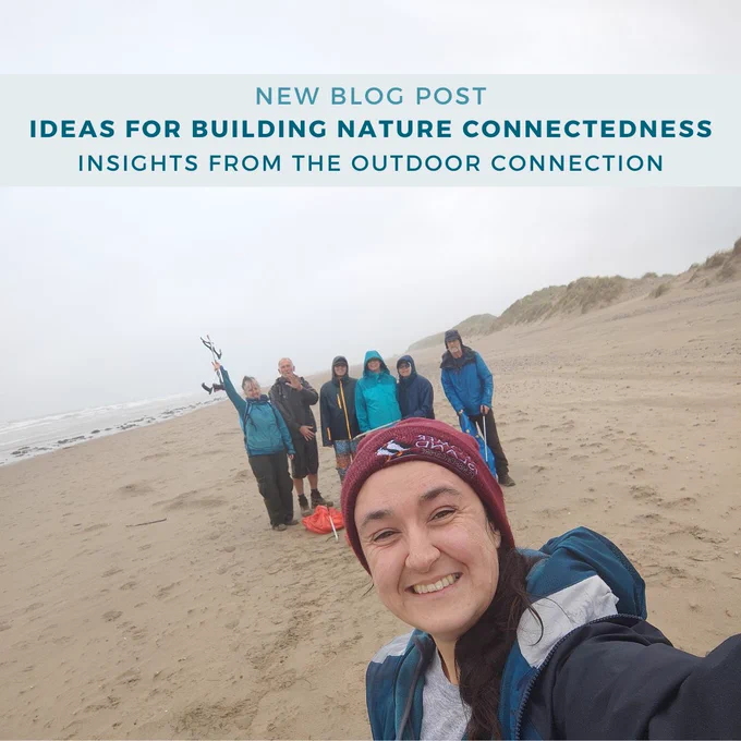 Group of people on the beach holding litter-picking equipment and posing in the background of a selfie that Hannah is taking. A blue title at the top of the image reads: New Blog Post: Ideas for building nature connectedness. Insights from the outdoor connection.