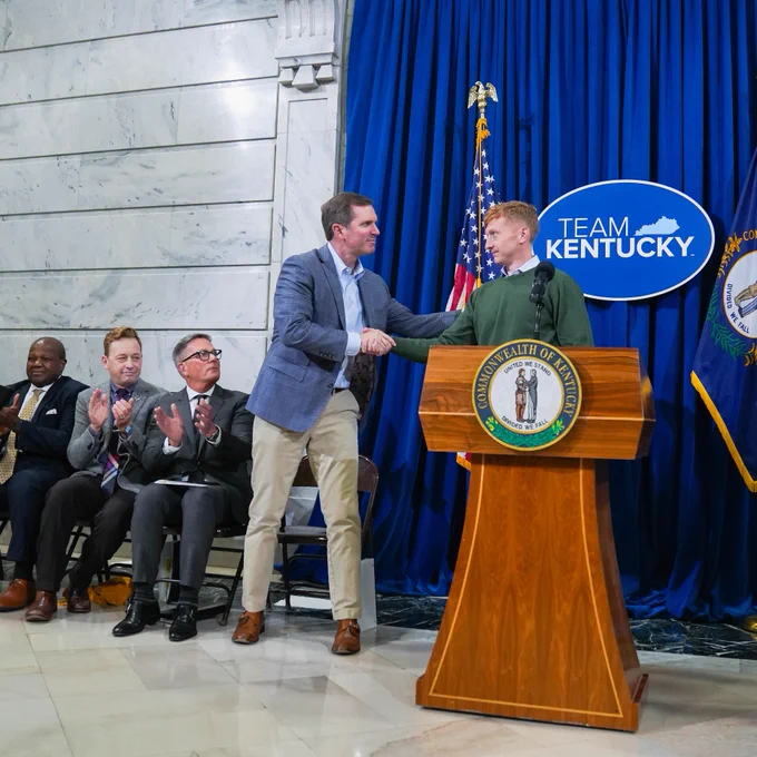An image of Governor Beshear shaking hands with Tyler Childers