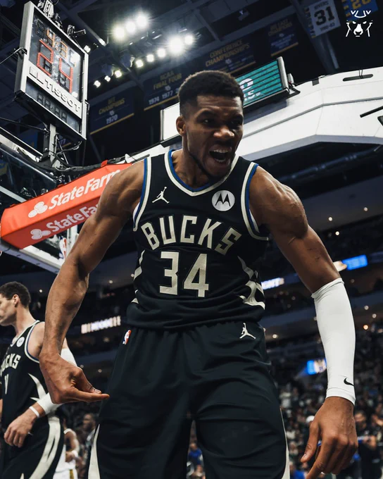 A photo of Giannis Antetokounmpo pumped up and yelling into the camera.