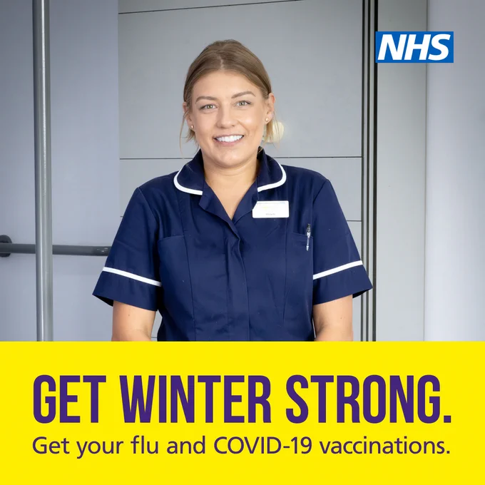 A photograph of a midwife standing in a hospital setting. Text reads: ‘GET WINTER STRONG. Get your flu and COVID-19 vaccinations.’