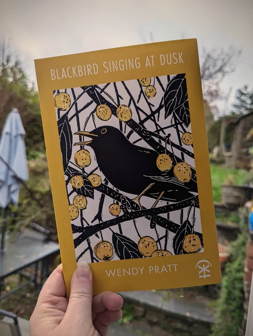 Blackbird singing at dusk by Wendy Pratt, published by Nine Arches Press. Cover is mustard yellow with a linocut of a blackbird singing in an crabapple tree. 