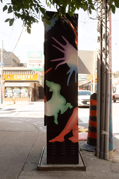 A human form reclines amongst floating visuals including dogs, a bird, moths, a milkweed pod and a snake. All forms are awash in gradients of purple, blue, green and red. The negative space around these forms is solid black.